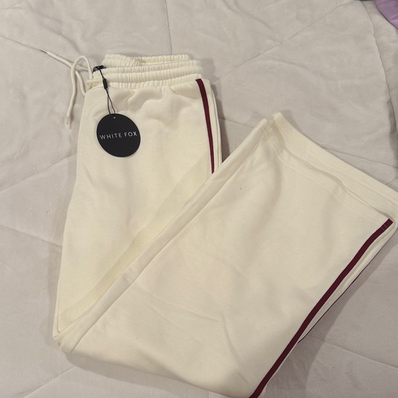 White Fox Boutique Pants - White Fox Boutique Cream Wide Leg Pants with Red Stripe